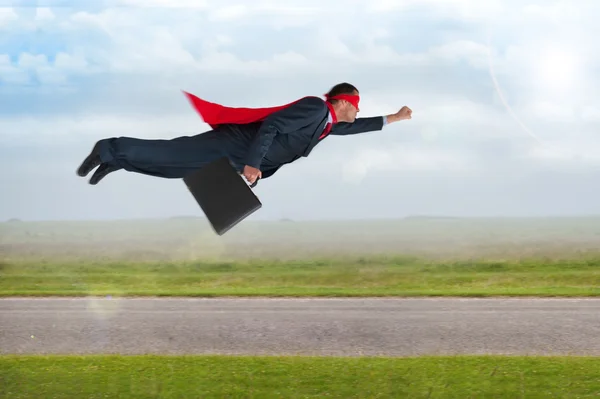 Superhero businessman flying — Stock Photo, Image