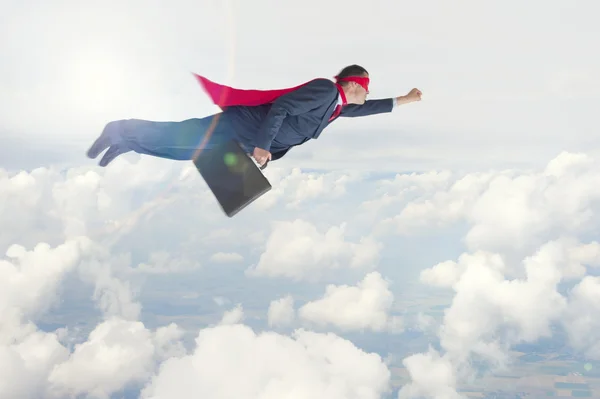Homem de negócios super-herói em voo Fotos De Bancos De Imagens
