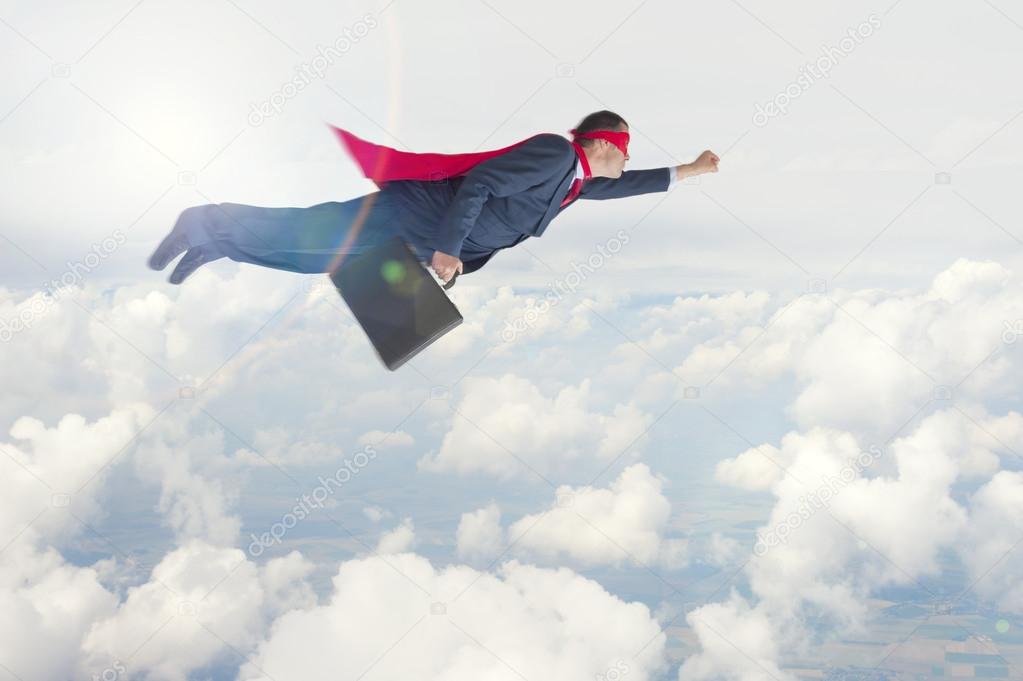 Superhero businessman in flight