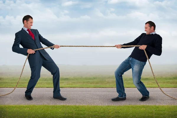 Tug of war between the same man — Stock Photo, Image