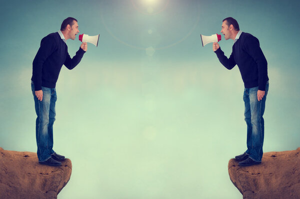 Men shouting megaphone canyon
