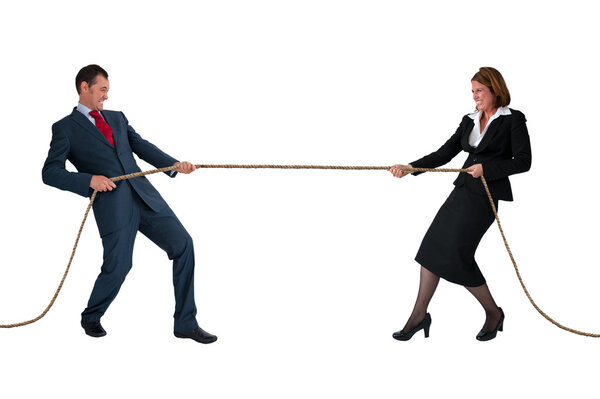 Businessman and woman tug of war isolated on white