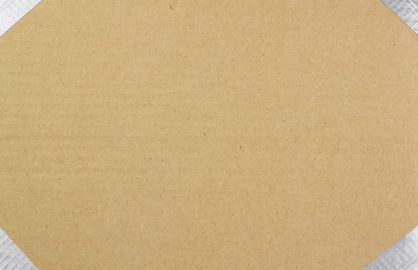 Фон из коричневого картона с изолентой по краям — стоковое фото