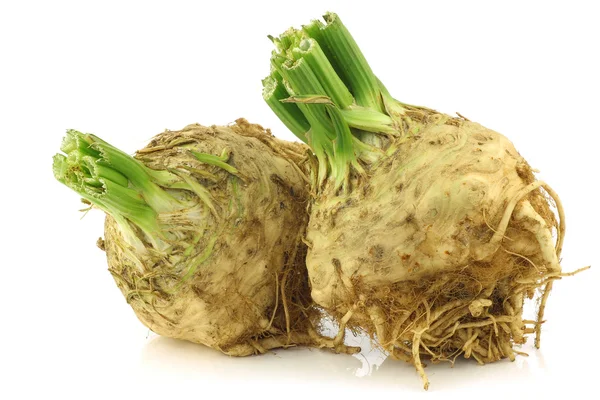 Fresh celery roots with some foliage — Stock Photo, Image