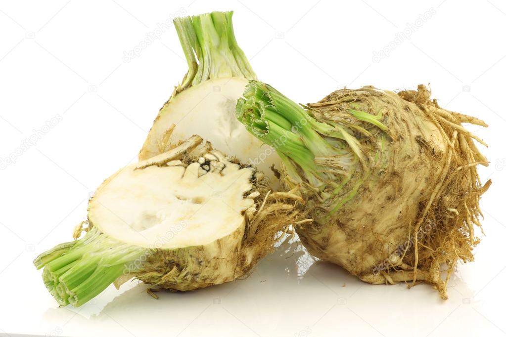 Freshly harvested celery root and a cut one