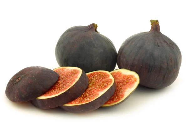 Two whole and a cut fig (Ficus carica) — Stock Photo, Image