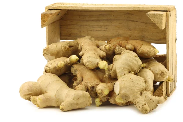 Dried pieces of ginger root in a wooden crate — Stock Photo, Image