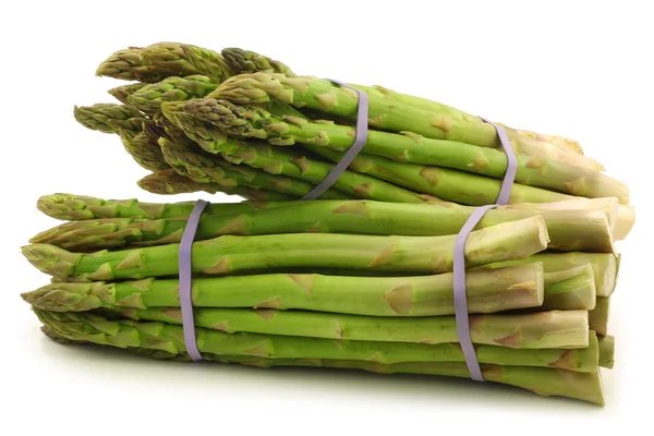 Fresh asparagus shoots in bundles — Stock Photo, Image