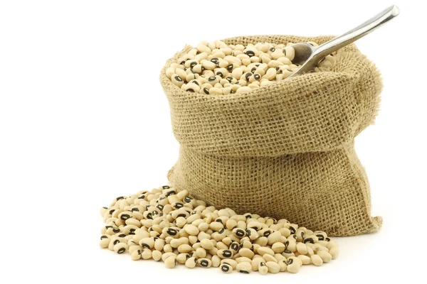 Green peas in a burlap bag with an aluminum scoop Stock Photo by ©tpzijl  11353603