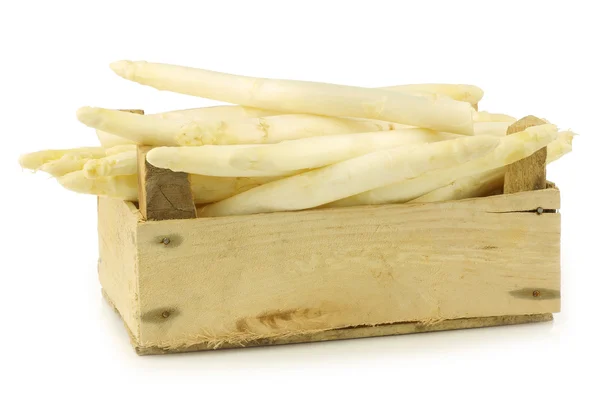 Fresh white asparagus shootsin a wooden crate — Stock Photo, Image