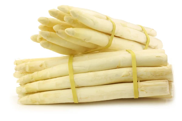 Fresh white asparagus shootsin a wooden crate — Stock Photo, Image