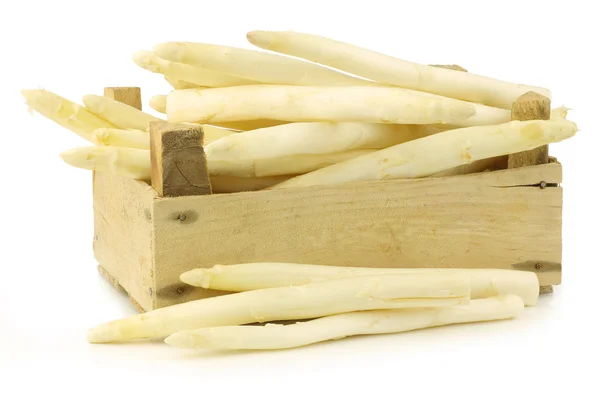 Fresh white asparagus shootsin a wooden crate — Stock Photo, Image