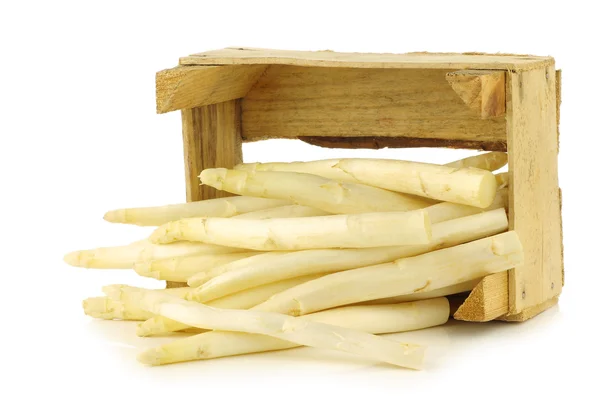 Fresh white asparagus shootsin a wooden crate — Stock Photo, Image