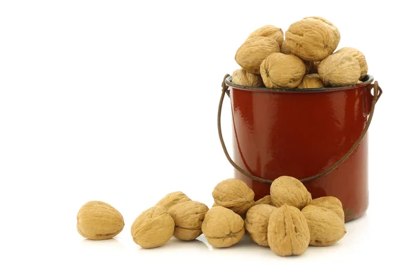 Fresh walnuts in an enamel cooking pot — Stock Photo, Image