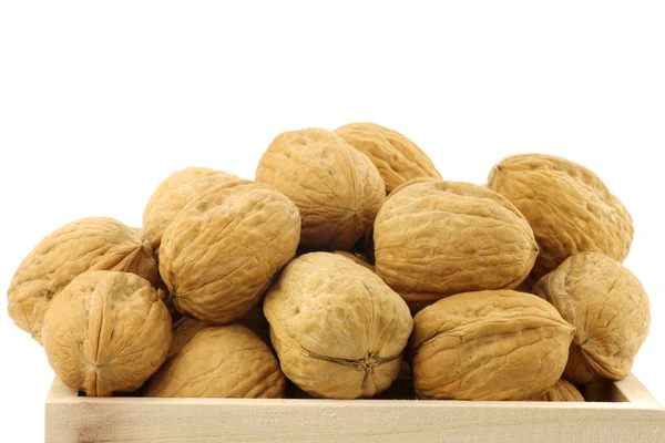 Fresh walnuts in a wooden box with rope handles — Stock Photo, Image