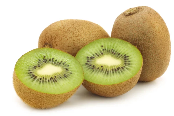 Fresh kiwi fruit and a cut one — Stock Photo, Image