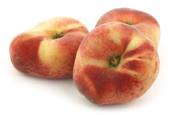 Fresh colorful flat peaches (donut peaches) — Stock Photo, Image