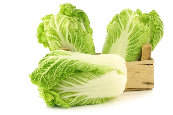 Fresh chinese cabbage in a wooden crate — Stock Photo, Image
