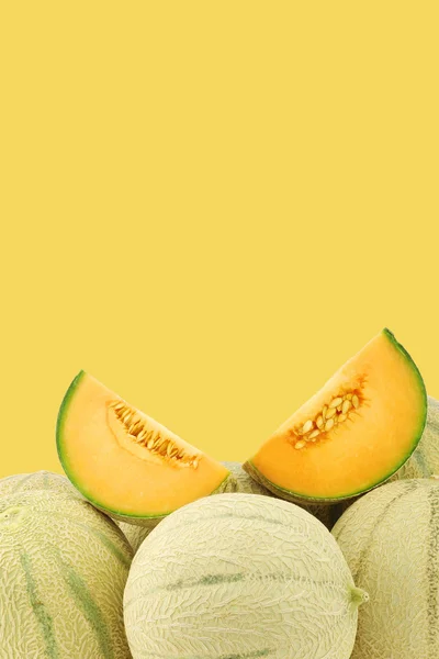 Fresh cantaloupe melons and a cut one — Stock Photo, Image