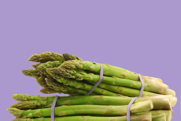 Fresh asparagus shoots in bundles — Stock Photo, Image