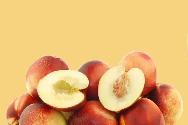 Fresh nectarines and a cut one — Stock Photo, Image