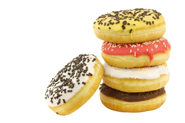 Empilhados sortidos coloridos donuts envidraçados com polvilhas — Fotografia de Stock