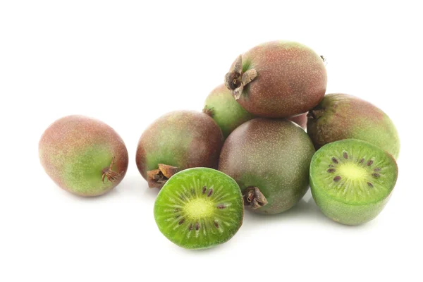 Kiwi berries and a cut one — Stock Photo, Image