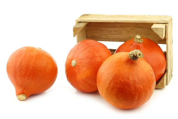 Fresh orange pumpkins in a wooden crate — Stock Photo, Image