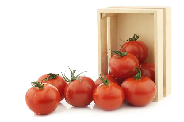 Fresh tomatoes in a wooden box — Stock Photo, Image