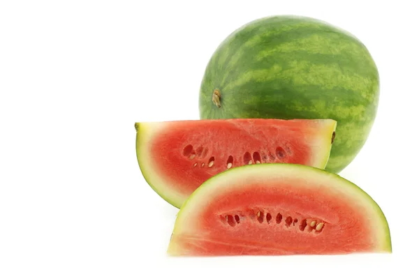 Fresh watermelon and some cut pieces — Stock Photo, Image