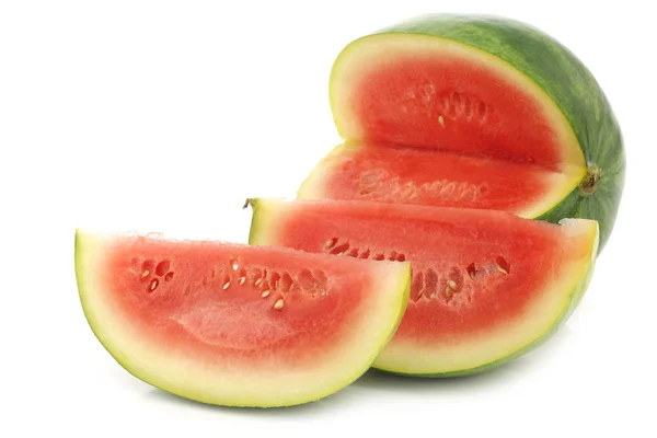 Fresh watermelon and some cut pieces — Stock Photo, Image