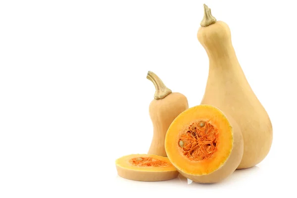 Bottle shaped butternut pumpkin and a cut one — Stock Photo, Image