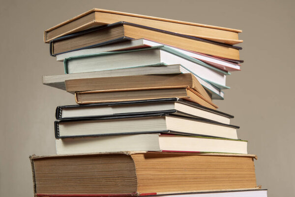 Close-up of background stack of old used books. Pile of vintage old books. Back to school. copy space