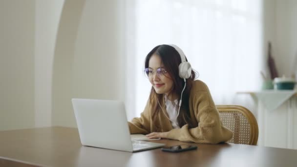 Young Asian Woman Wearing Glasses Headset Working Computer Laptop House — Stockvideo