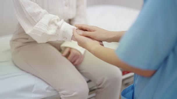 Hand Female Doctor Comforting Patient Consulting Room Woman Doctor Patient — Vídeo de stock