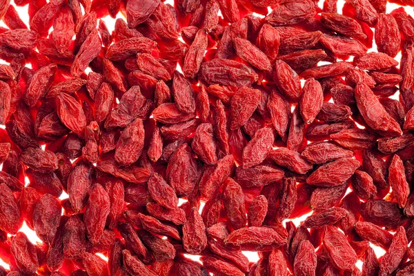 Hodně červené goji Berry izolovaných na bílém pozadí zblízka — Stock fotografie