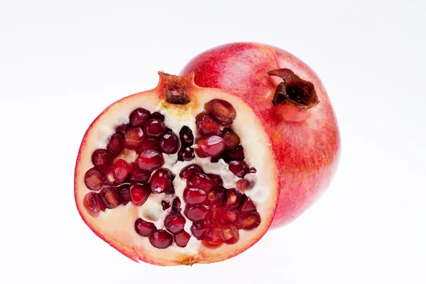 Sectioned pomegranate isolated on white background — Stock Photo, Image