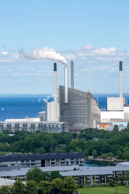 Copenhagen, Denmark - June 22, 2019: Amager Bakke (Copenhill), combined heat and power plant and waste incineration plant on Amager Island. It is also a ski run and a climbing wall
