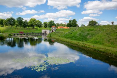 Copenhagen, Denmark - June 22, 2019: Old Citadel, Kastellet, view on bridge and King Gate in sunny day