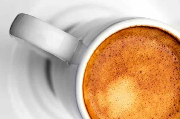 Macro close up studio shot of a half cup of espresso coffee - diagonal — Stock Photo, Image
