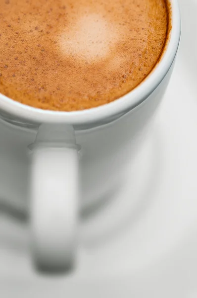 Macro close up studio shot of a half cup of espresso coffee — Stock Photo, Image