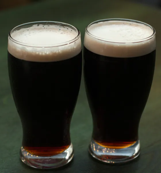 Two glasses of dark beer — Stock Photo, Image