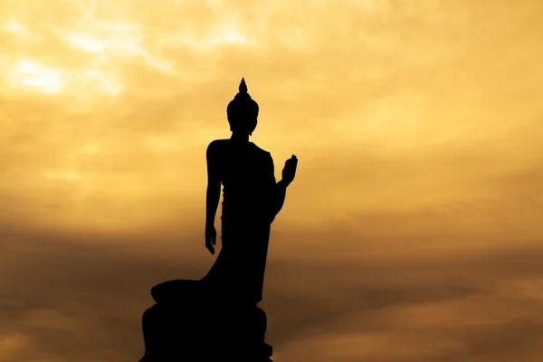 Buddha silhouette on sunset sky. — Stock Photo, Image