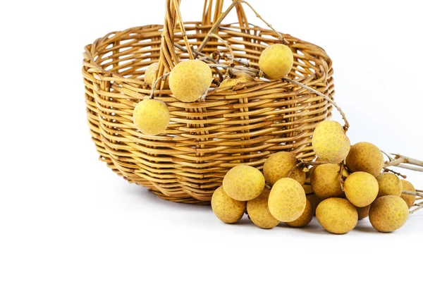 Wicker basket and longan on white background — Stock Photo, Image