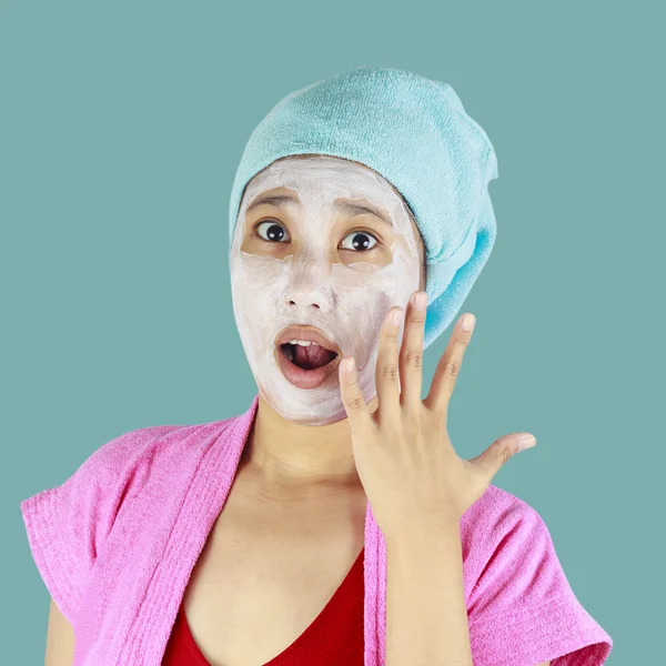 Asian women look shocked facial mask. — Stock Photo, Image