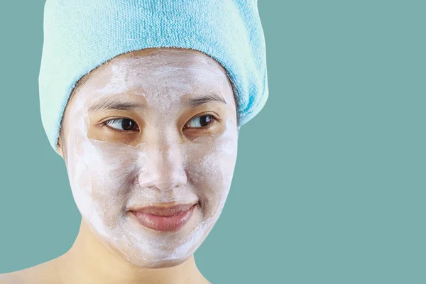 Beauty asian woman getting facial mask — Stock Photo, Image