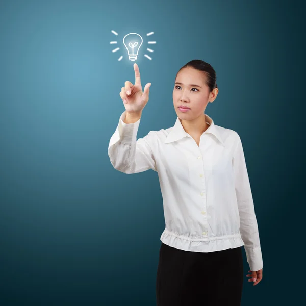 Business woman touch screen with lamp symbol. For business conce — Stock Photo, Image