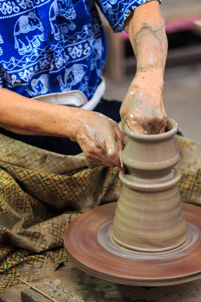 Potter hands making in clay on pottery wheel. — Stock Photo, Image