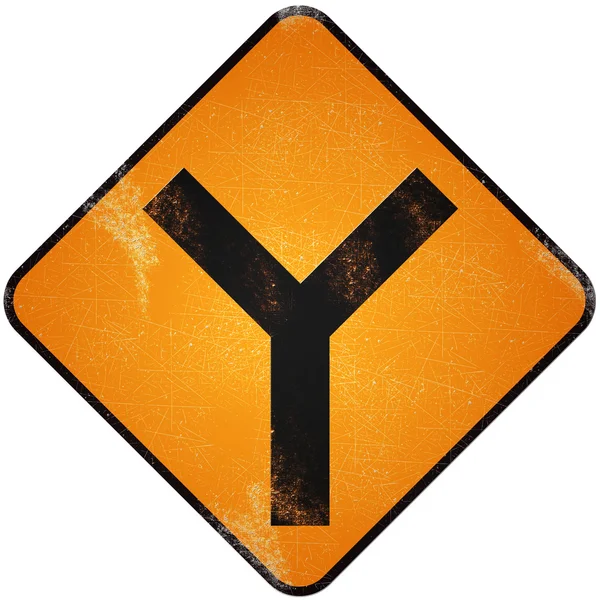 Fork road sign. Damaged yellow metallic road sign with fork symb — Stock Photo, Image