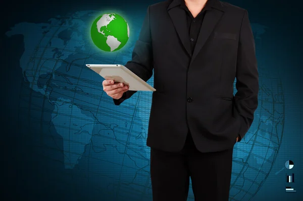 Businessman holding a tablet with globe — Stock Photo, Image